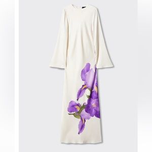 White dress with purple flower detail.
